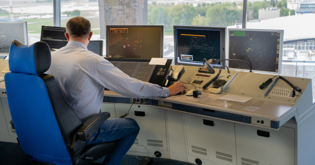 An ATC controller looking at screens